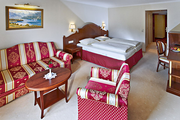 Junior Suite with balcony to the lake and village at the Hotel Berner in Zell am See.